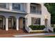 Beautifully lit front of a home with lush landscaping, a inviting pool, and architectural details at 5009 W Spring Lake Dr, Tampa, FL 33629