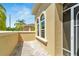 Private patio with brick pavers and arched windows at 2121 Sifield Greens Way # 64, Sun City Center, FL 33573