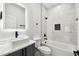 Modern bathroom features white marble tiling, vessel sink, LED mirror, and dark fixtures at 3230 Azalea Drive # Lot 13, Hernando Beach, FL 34607