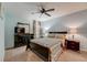 Bedroom with a queen bed, dresser, and ceiling fan at 14266 Creek Run Dr, Riverview, FL 33579