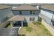 Aerial view of house, backyard, and patio at 9358 Rally Spring Loop, Wesley Chapel, FL 33545