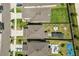 Aerial view of home with fenced backyard, patio, pergola, and landscaping at 9358 Rally Spring Loop, Wesley Chapel, FL 33545