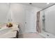 Bathroom with shower and double vanity at 9358 Rally Spring Loop, Wesley Chapel, FL 33545