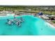 Crystal-clear lagoon with water features and activities at 9358 Rally Spring Loop, Wesley Chapel, FL 33545
