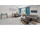 Living room with sectional sofa and dining area at 9358 Rally Spring Loop, Wesley Chapel, FL 33545