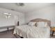 Main bedroom with plush bed and ensuite bathroom at 9358 Rally Spring Loop, Wesley Chapel, FL 33545