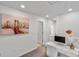 Second view of the home office space with a view down the hallway at 9358 Rally Spring Loop, Wesley Chapel, FL 33545