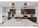 Modern kitchen with an island and stainless steel appliances at 9358 Rally Spring Loop, Wesley Chapel, FL 33545