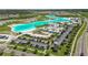 Large lagoon with surrounding community at 9358 Rally Spring Loop, Wesley Chapel, FL 33545