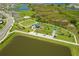 An aerial view of a park with walking paths and recreational facilities at 9358 Rally Spring Loop, Wesley Chapel, FL 33545