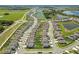 Community view of homes with lush landscaping at 9358 Rally Spring Loop, Wesley Chapel, FL 33545