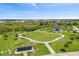 An aerial view of a park with playground, walking paths and a dog park at 9358 Rally Spring Loop, Wesley Chapel, FL 33545