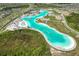 Expansive lagoon amenity with beach access at 9358 Rally Spring Loop, Wesley Chapel, FL 33545