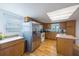 Kitchen boasts stainless steel appliances and wood cabinets at 821 White Heron Blvd, Ruskin, FL 33570