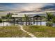 Private boat dock with covered area and walkway at 821 White Heron Blvd, Ruskin, FL 33570