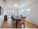 Bright dining room with a table and chairs, and hardwood floors at 821 White Heron Blvd, Ruskin, FL 33570