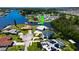 Aerial view of house on a canal with boat dock at 821 White Heron Blvd, Ruskin, FL 33570