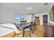 Dining room with table, chairs, and view into kitchen at 821 White Heron Blvd, Ruskin, FL 33570