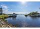 Relaxing view of a canal with a dock and boats at 821 White Heron Blvd, Ruskin, FL 33570