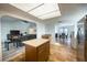 Open kitchen with island, stainless steel appliances, and views to living and dining areas at 821 White Heron Blvd, Ruskin, FL 33570