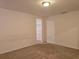 Bedroom with carpeted floors and a walk-in closet at 6949 Crested Orchid Dr, Brooksville, FL 34602