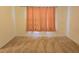 Bedroom with carpeted floors and peach curtains at 6949 Crested Orchid Dr, Brooksville, FL 34602