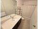 Neat bathroom, featuring a vanity, tub, and shower at 6949 Crested Orchid Dr, Brooksville, FL 34602