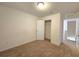 Bright bedroom with closet and access to upstairs hallway at 6949 Crested Orchid Dr, Brooksville, FL 34602