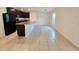Open concept kitchen and dining area with tile floors at 6949 Crested Orchid Dr, Brooksville, FL 34602
