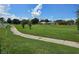 Landscaped path alongside a beautiful golf course at 6949 Crested Orchid Dr, Brooksville, FL 34602