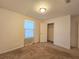 Spacious bedroom featuring a large closet and neutral decor at 6949 Crested Orchid Dr, Brooksville, FL 34602