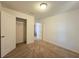 Spacious bedroom with closet and access to hallway at 6949 Crested Orchid Dr, Brooksville, FL 34602