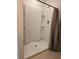 Clean shower with built-in shelving and a shower curtain at 6949 Crested Orchid Dr, Brooksville, FL 34602