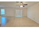 Bright living room with tile floors and sliding glass doors at 6949 Crested Orchid Dr, Brooksville, FL 34602