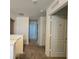 Upstairs hallway with doors to bedrooms and bathrooms at 6949 Crested Orchid Dr, Brooksville, FL 34602