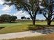 Peaceful golf course landscape with mature trees at 6949 Crested Orchid Dr, Brooksville, FL 34602