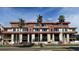 Modern building exterior with several units, palm trees, and street view at 85 Davis Blvd # A, Tampa, FL 33606