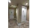 Building hallway with doors to various rooms at 140 Riviera Dunes Way # 1403, Palmetto, FL 34221