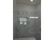 Modern shower with marble walls and glass door at 3917 W Robson St, Tampa, FL 33614