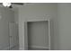 Well-lit bedroom with ceiling fan and closet at 3917 W Robson St, Tampa, FL 33614