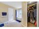 Bathroom including a shower with tub, blue accents, and a walk-in closet at 1442 Tiverton Dr, Brandon, FL 33511