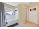 Bathroom featuring a shower with tub, a small window and neutral tiling at 1442 Tiverton Dr, Brandon, FL 33511