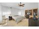 Bedroom with a ceiling fan, large windows, and built-in desk area at 1442 Tiverton Dr, Brandon, FL 33511