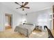 Bedroom featuring a ceiling fan, two windows, tile flooring, and natural light at 1442 Tiverton Dr, Brandon, FL 33511