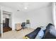 Spare bedroom featuring light tile floors, futon, and desk area at 1442 Tiverton Dr, Brandon, FL 33511