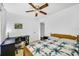 Inviting bedroom with a quilt, ceiling fan, and desk, offering a serene atmosphere at 1442 Tiverton Dr, Brandon, FL 33511