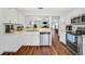 Bright kitchen with stainless steel appliances and wood-look floors at 1442 Tiverton Dr, Brandon, FL 33511