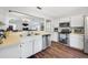 Bright kitchen with stainless steel dishwasher and wood-look floors at 1442 Tiverton Dr, Brandon, FL 33511