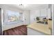 Bright kitchen with a window bench seat and modern wood-look floors at 1442 Tiverton Dr, Brandon, FL 33511