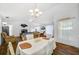 Open-concept living and dining area with bright lighting and gorgeous floors at 1442 Tiverton Dr, Brandon, FL 33511
